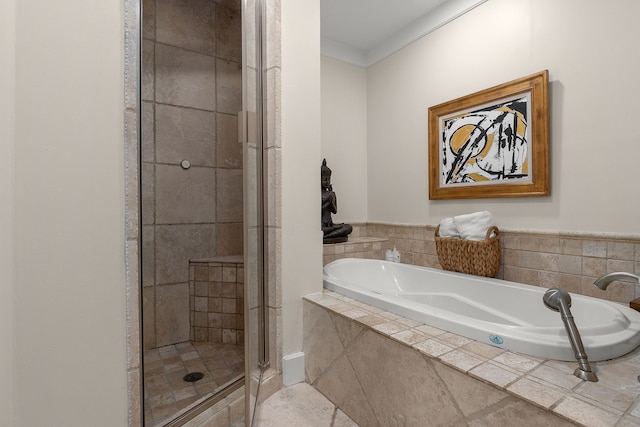 bathroom featuring separate shower and tub