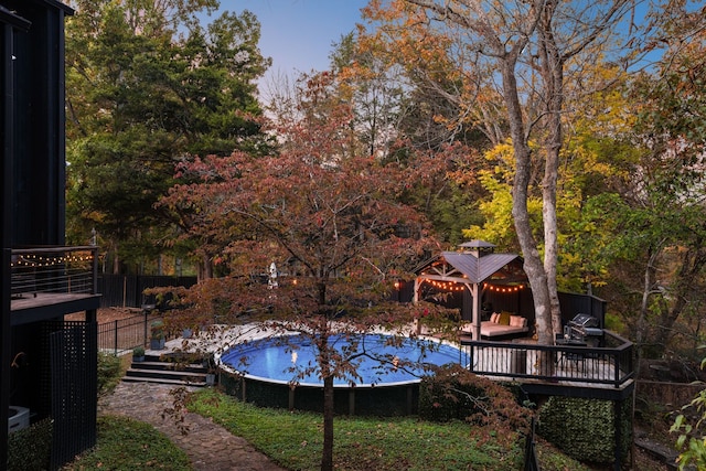 view of pool with a wooden deck