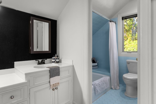 full bathroom with toilet, tile patterned flooring, shower / bath combination with curtain, vaulted ceiling, and vanity