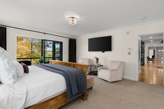 carpeted bedroom with ornamental molding