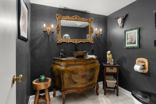 bathroom featuring toilet, vanity, and tile patterned floors