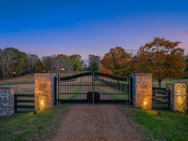 view of gate at dusk