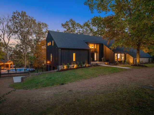 view of front of property with a lawn