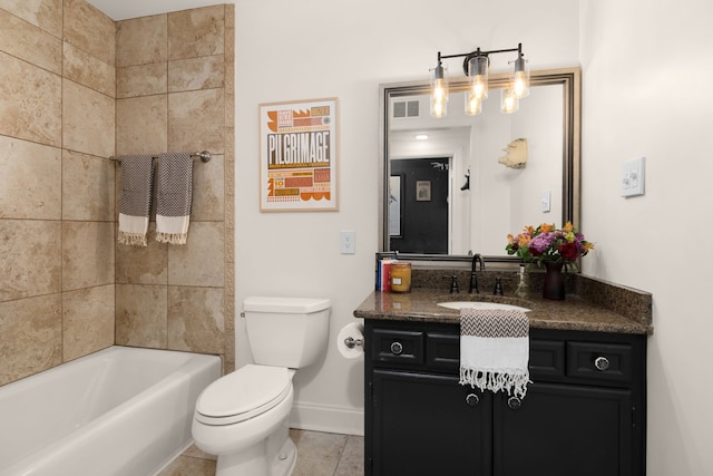 bathroom featuring vanity, toilet, and tile patterned floors