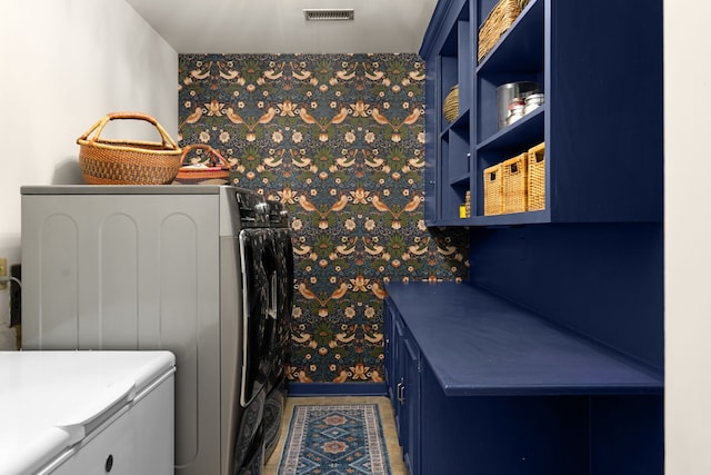 laundry area with washing machine and clothes dryer