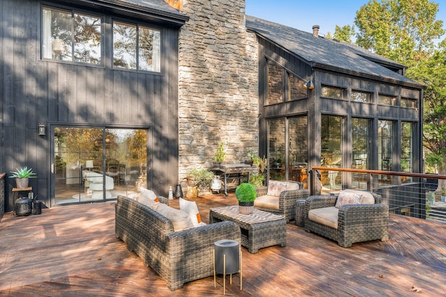 wooden terrace featuring an outdoor living space