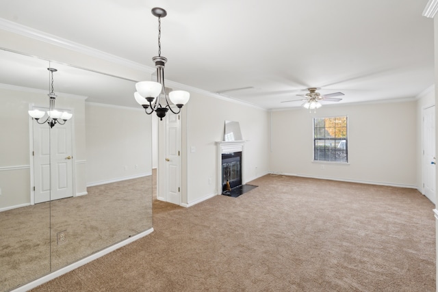 unfurnished living room featuring ceiling fan, ornamental molding, and carpet floors