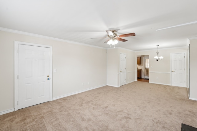 carpeted spare room with crown molding and ceiling fan with notable chandelier