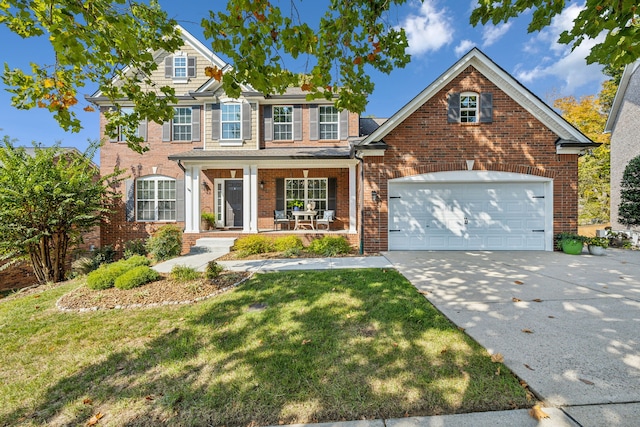 view of front facade featuring a porch, a front lawn, and a garage