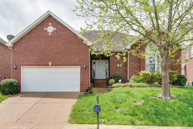 view of front of house featuring a front yard and a garage