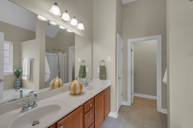 bathroom featuring vanity, tile patterned floors, and walk in shower