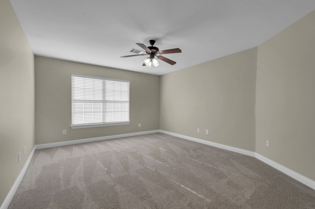 carpeted empty room with ceiling fan