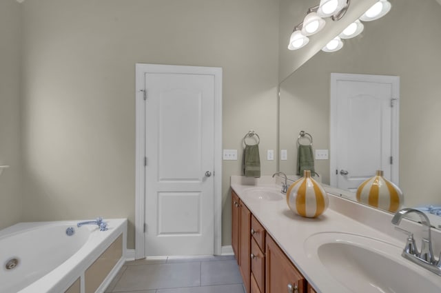 bathroom featuring vanity, tile patterned floors, and a bathtub