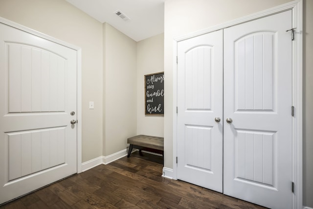 entryway with dark wood-type flooring