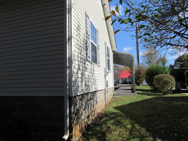 view of property exterior featuring a lawn