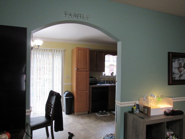 office featuring ornamental molding, sink, and a wealth of natural light