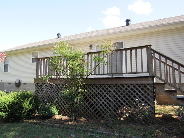 rear view of property with a wooden deck