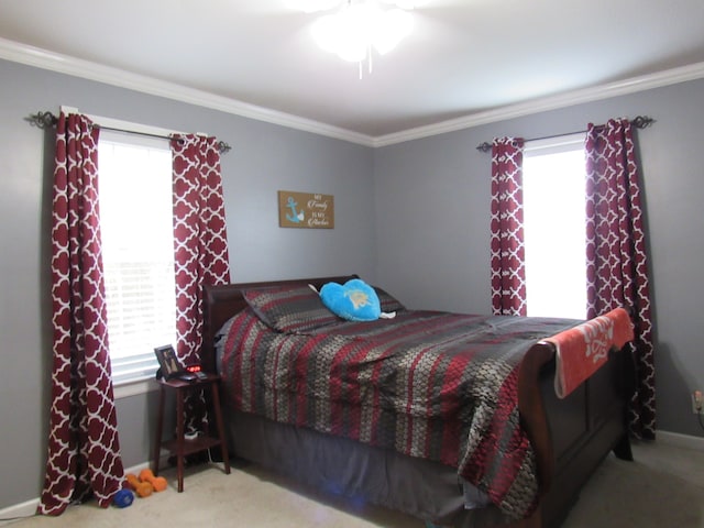 carpeted bedroom featuring crown molding