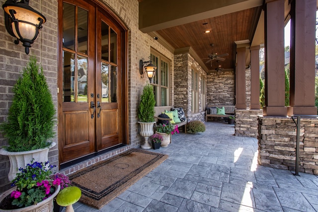 doorway to property with ceiling fan, french doors, and a porch