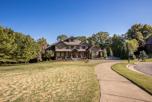 craftsman-style house featuring a front lawn