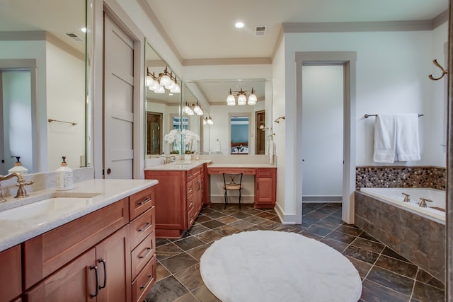 bathroom featuring tiled bath, vanity, and ornamental molding