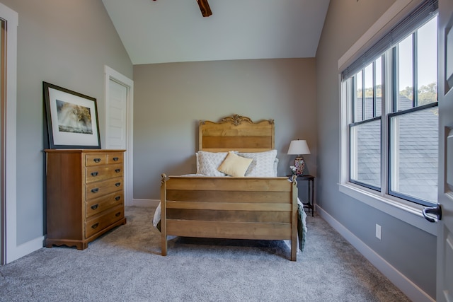 carpeted bedroom featuring ceiling fan and lofted ceiling