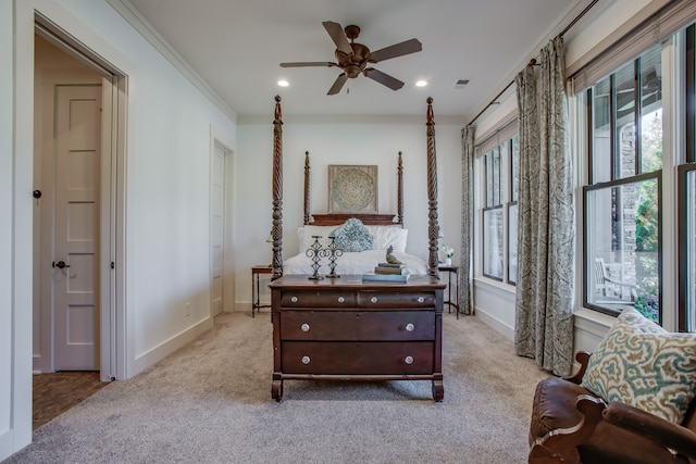 sitting room featuring ceiling fan, crown molding, and light carpet