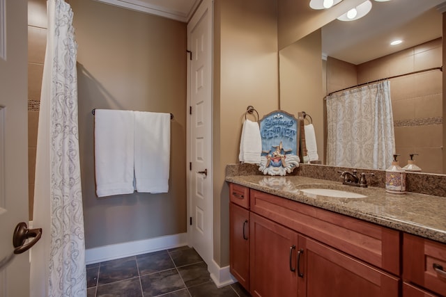 bathroom featuring tile patterned flooring, vanity, and crown molding