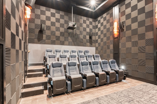 cinema room featuring a towering ceiling