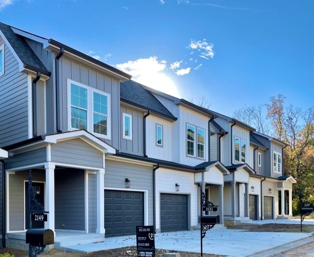 multi unit property featuring a garage