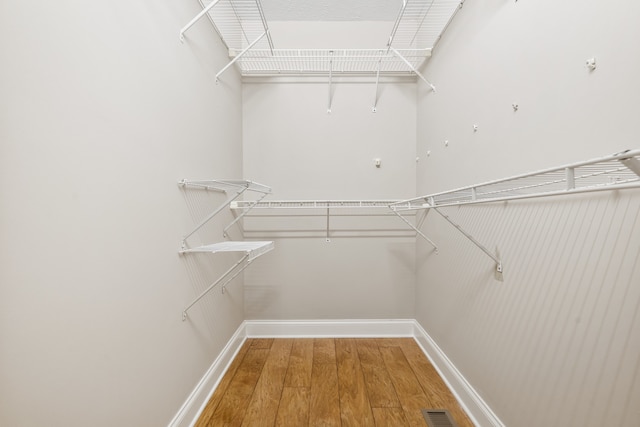 spacious closet featuring wood-type flooring