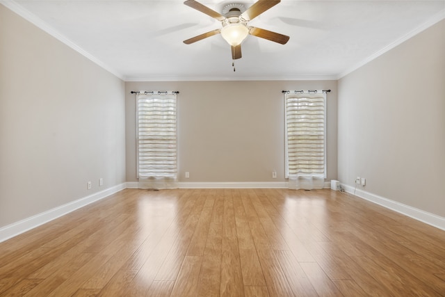 empty room featuring ornamental molding, light wood-type flooring, and ceiling fan