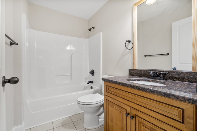 full bathroom featuring toilet, vanity, tile patterned floors, and shower / washtub combination