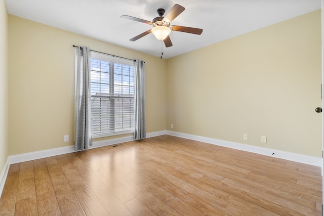 empty room featuring light hardwood / wood-style floors and ceiling fan