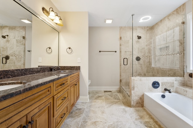 full bathroom with toilet, vanity, and separate shower and tub