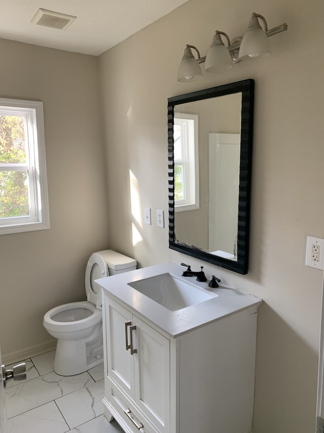 bathroom with vanity and toilet