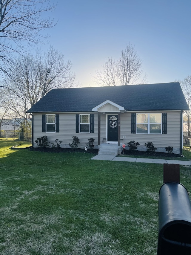 single story home with a front yard