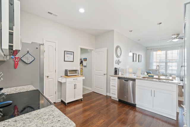 kitchen featuring stainless steel dishwasher, sink, dark hardwood / wood-style floors, and white cabinets