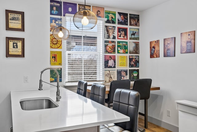 office area featuring hardwood / wood-style flooring and sink