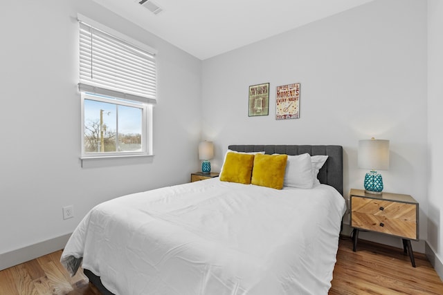 bedroom featuring wood-type flooring