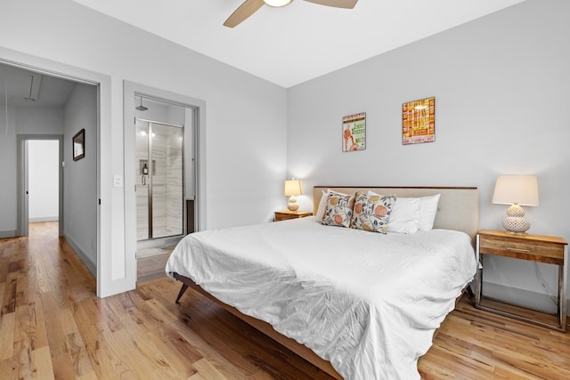 bedroom with ceiling fan, light hardwood / wood-style flooring, and ensuite bath