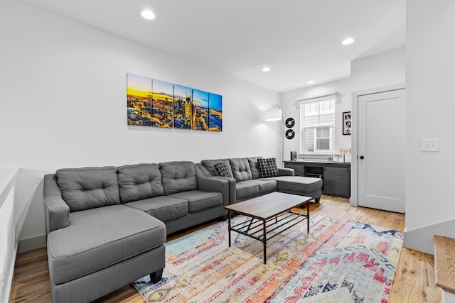 living room with light hardwood / wood-style flooring