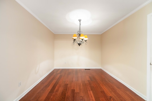 unfurnished room with ornamental molding, a chandelier, and dark hardwood / wood-style floors