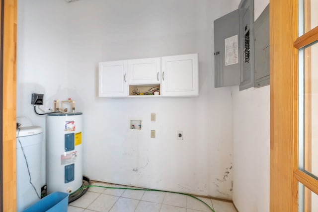 clothes washing area featuring electric panel, washer hookup, water heater, light tile patterned flooring, and hookup for an electric dryer