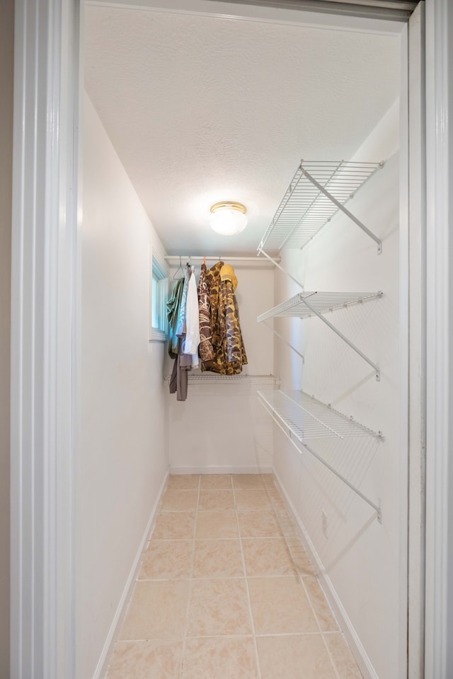 spacious closet with tile patterned flooring