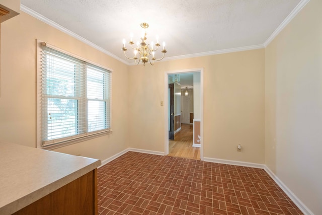 unfurnished dining area with crown molding, a textured ceiling, and a notable chandelier