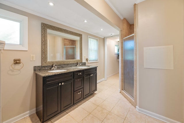 bathroom featuring vanity, an enclosed shower, tile patterned flooring, and crown molding