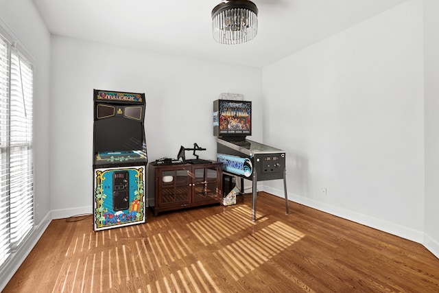 office area with wood-type flooring and a chandelier