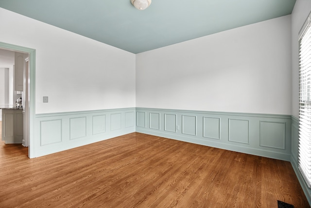 empty room featuring wood-type flooring