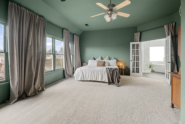 carpeted bedroom with lofted ceiling and ceiling fan